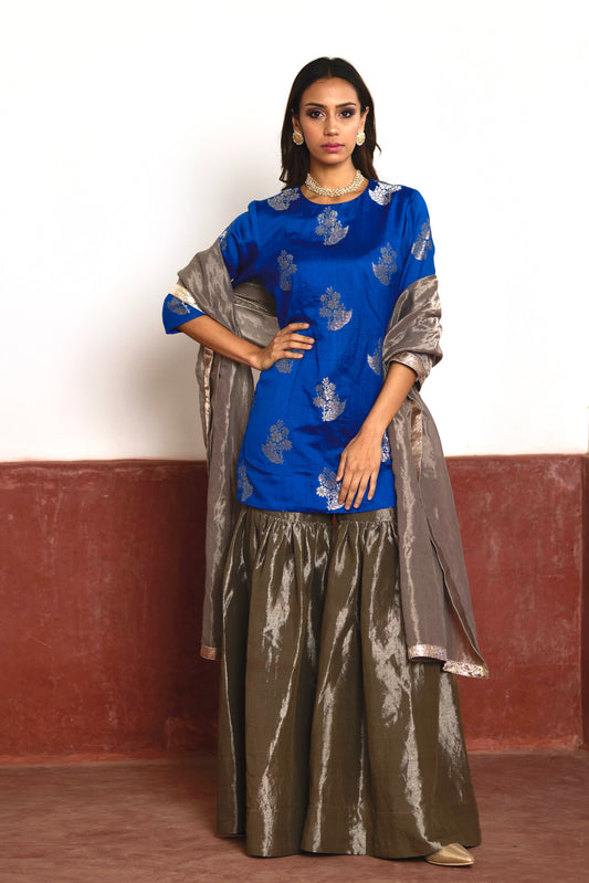 Zero Neck Short Kurta in Blue Brocade with Silver Tissue Sharara