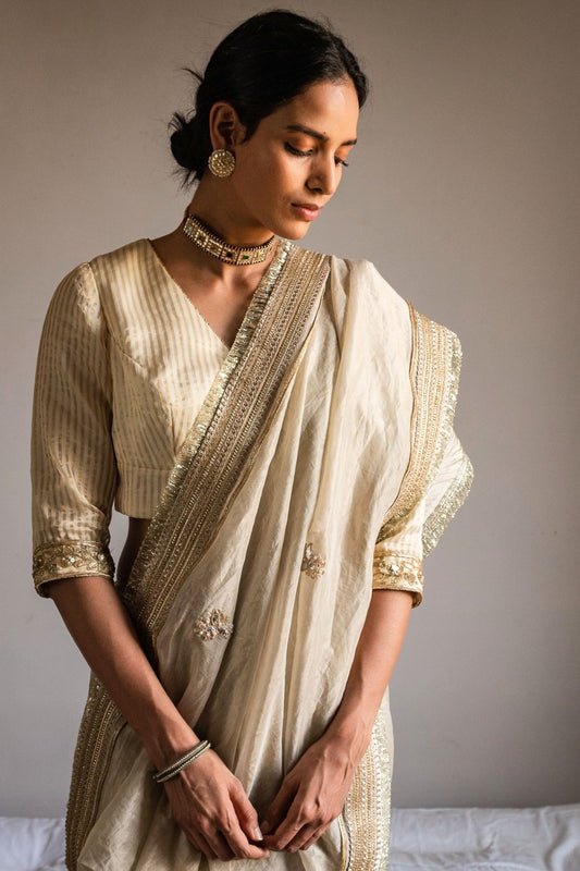 Saree hand embroidered in Ivory Handloom tissue