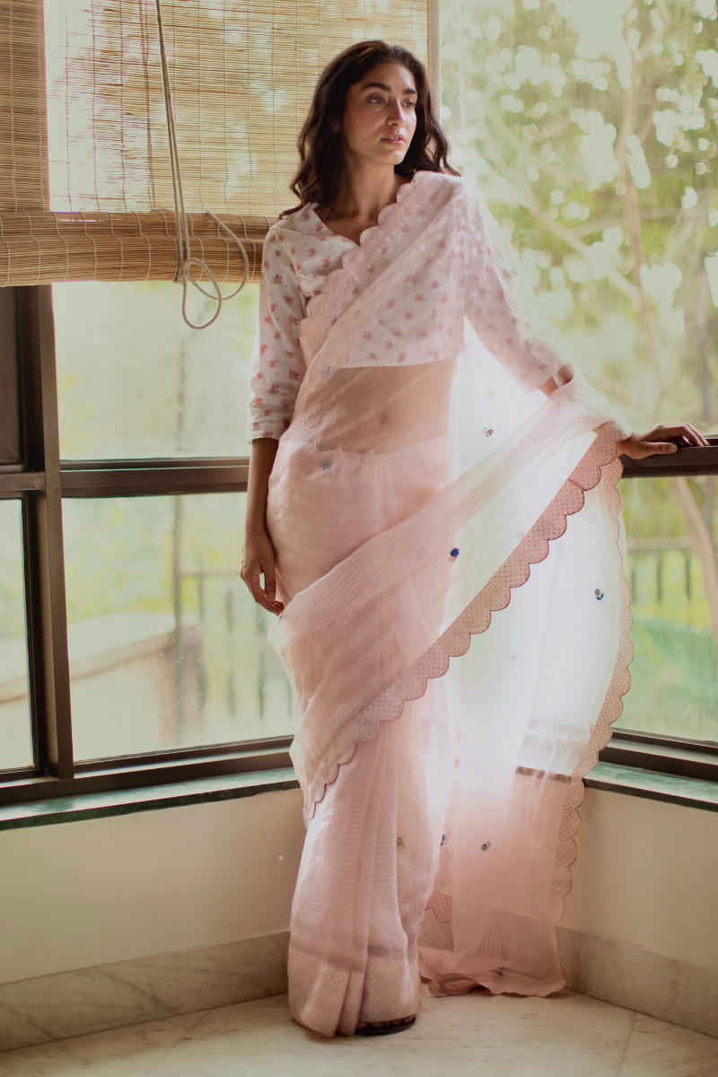 Shell pink silk organza self stripes sari with hand embroidered flowers